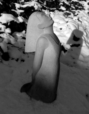Portland stone kneeling figure